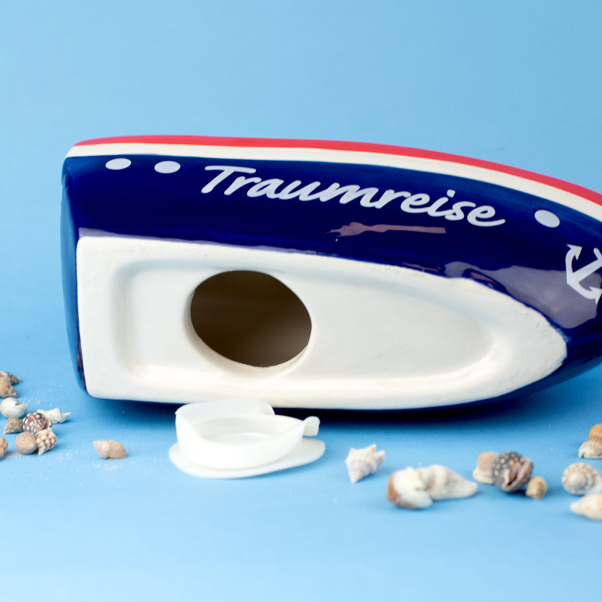Spardose Schiff Traumreise geöffnet an der Unterseite mit Gummiverschluss