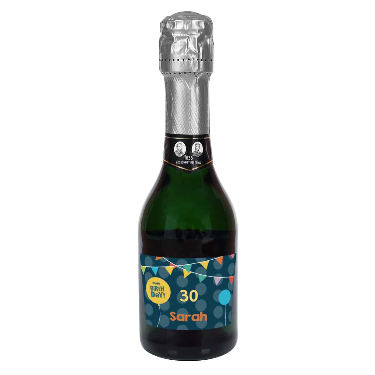 Kleine Sektflasche mit Name und Alter auf dem Etikett zum Geburtstag