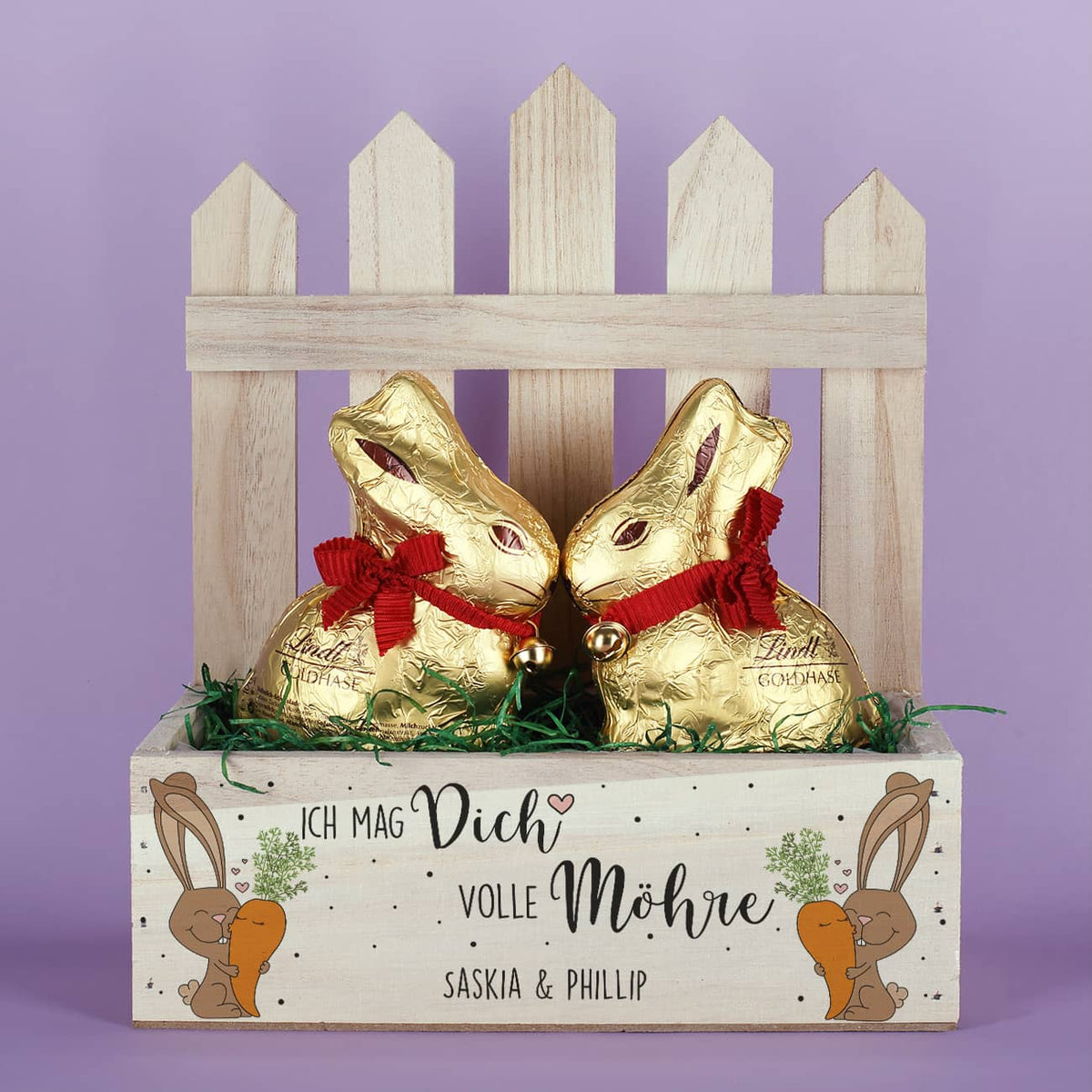 Enthält zwei Lindt Hasen & Ostergras als Dekoration