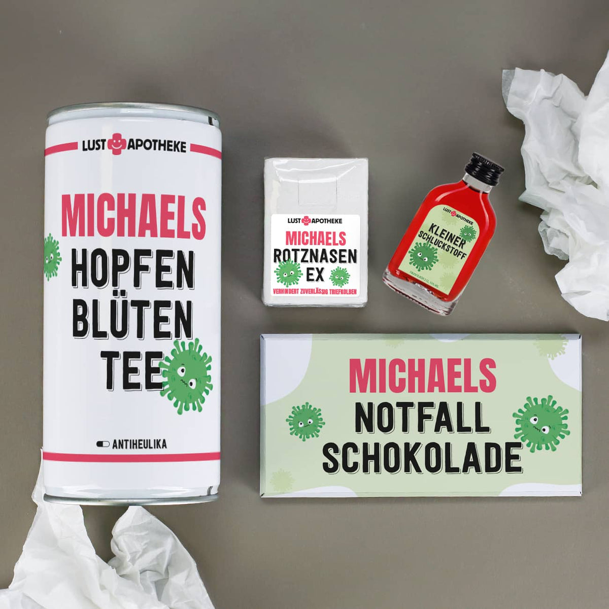 Geschenkset bei Männerschnupfen mit Bier, Schnaps, Schokolade und Taschentüch