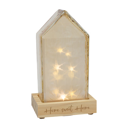 Freistehendes Leonardo Glas-Dekohaus in Amber mit LED-Beleuchtung und graviertem Sockel – warm schimmernde Wohnraumdeko im Haus-Look.