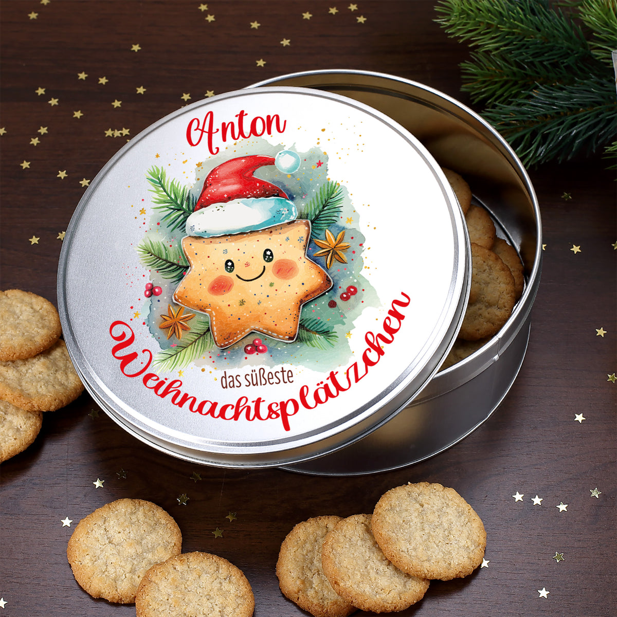 Geöffnete Keksdose mit Name Anton und Weihnachtsplätzchen Motiv auf dem Deckel