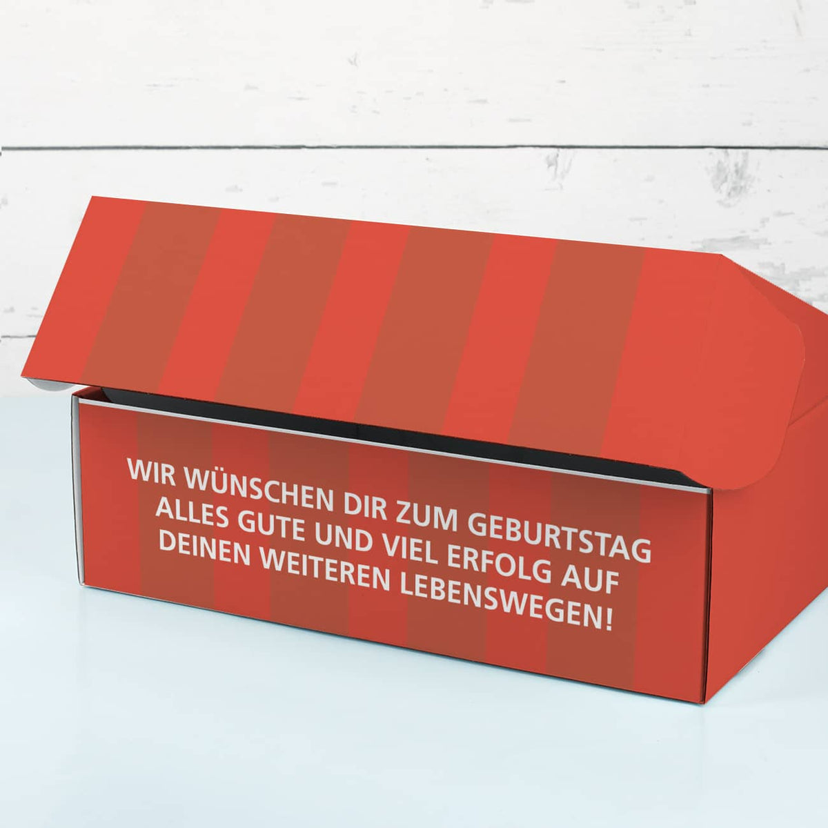 Rote Geschenkbox mit verstecktem Wunschtext