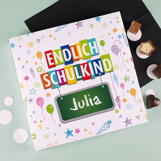 Pralinenschachtel bedruckt mit bunten Schulelementen 