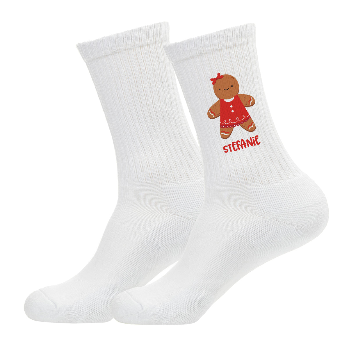 Freigestellte weiße Socken mit Lebkuchenfrau-Motiv und rotem Namensdruck.